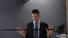In a scene from a YouTube video, Adam Giambrone prepares to reject using a broom as a mayoral campaign prop.