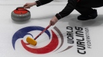 Canada vice-skip Mark Nichols releases a rock during a practice session at the World Curling Championship, Friday, March 31, 2023 in Ottawa. (Adrian Wyld/THE CANADIAN PRESS)