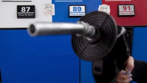 Gas prices are displayed as a motorist prepares to pump gas at a station in North Vancouver, B.C., Tuesday, May 10, 2011. THE CANADIAN PRESS/Jonathan Hayward