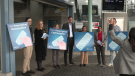 B.C. Premier David Eby poses for a photo outside Vancouver's VCC-Clark SkyTrain station at an event to raise awareness about the province funding free birth control beginning April 1, 2023. (CTV)