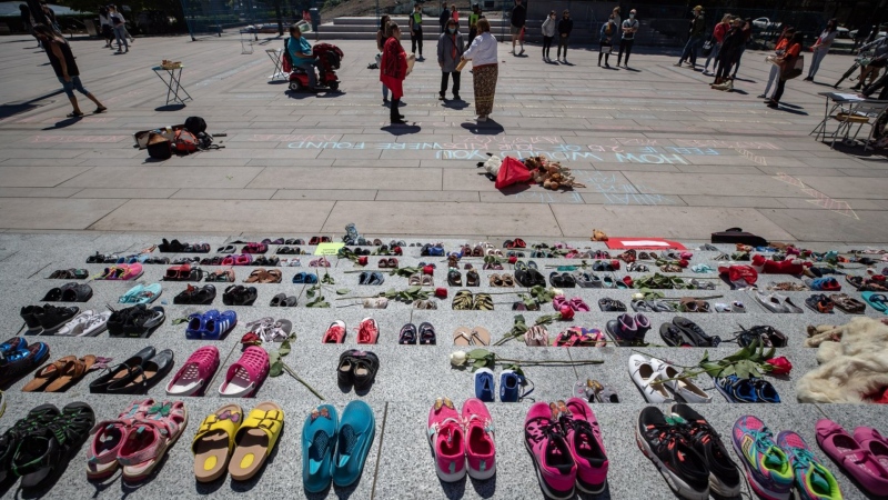 Two hundred and fifteen pairs of children's shoes are placed on the steps of the Vancouver Art Gallery n Vancouver on Friday, May 28, 2021, as a memorial to children who did not return from residential schools. THE CANADIAN PRESS/Darryl Dyck