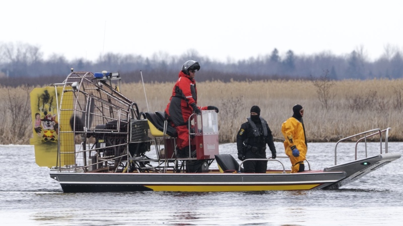 Searchers look for victims Friday, March 31, 2023. The bodies of eight migrants were pulled from the St. Lawrence River in Akwesasne, Que. THE CANADIAN PRESS/Ryan Remiorz

