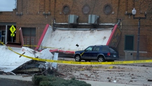 The marquee of the Apollo Theatre is down at the scene where the roof of the theatre collapsed during a tornado Friday evening, Saturday, April 1, 2023, in Belvidere, Ill. Belvidere Fire Chief Shawn Schadle said 260 people were in the venue for a concert. (AP Photo/Erin Hooley)