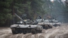 Ukrainian soldiers on captured Russian tanks T-72 hold military training close to the Ukraine-Belarus border near Chernihiv, Ukraine, Friday, Oct. 28, 2022. (AP Photo/Aleksandr Shulman, File)