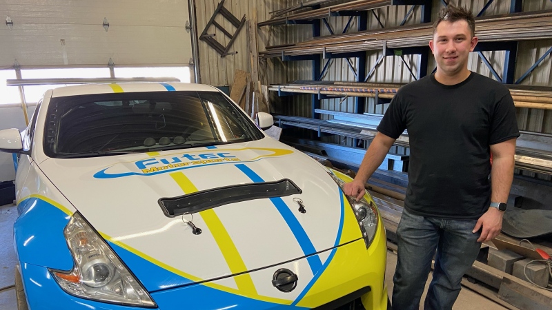 Nathan Blok at his garage in Beachburg with his new Nissan 370Z race car. (Dylan Dyson/CTV News Ottawa)