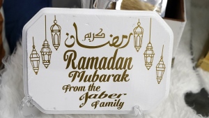 A Ramadan sign created by Suzanne Jaber of The Eid Shop is displayed in Dearborn Heights, Mich., on Monday, March 27, 2023. (AP Photo/Carlos Osorio)