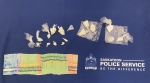 Saskatoon police seized 164.8 grams of crack cocaine, 47.7 grams of powdered cocaine, $2,750 CAD, a knife, multiple cell phones and other paraphernalia consistent with drug trafficking during an investigation. (Saskatoon Police Service)
