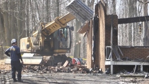 Crews work to clear the rubble after a house fire in Essa Township on Sat., April 1 (Steve Mansbridge/CTV News). 