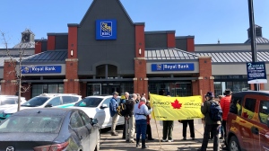 Protesters gathered outside the Unity Square RBC branch in central Edmonton on Saturday, April 1, 2023 (CTV News Edmonton/John Hanson).