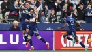 Vancouver Whitecaps' Simon Becher, from left to right, Brian White and Ali Ahmed celebrate White's goal against CF Montreal during the first half of an MLS soccer game in Vancouver, on Saturday, April 1, 2023. THE CANADIAN PRESS/Darryl Dyck