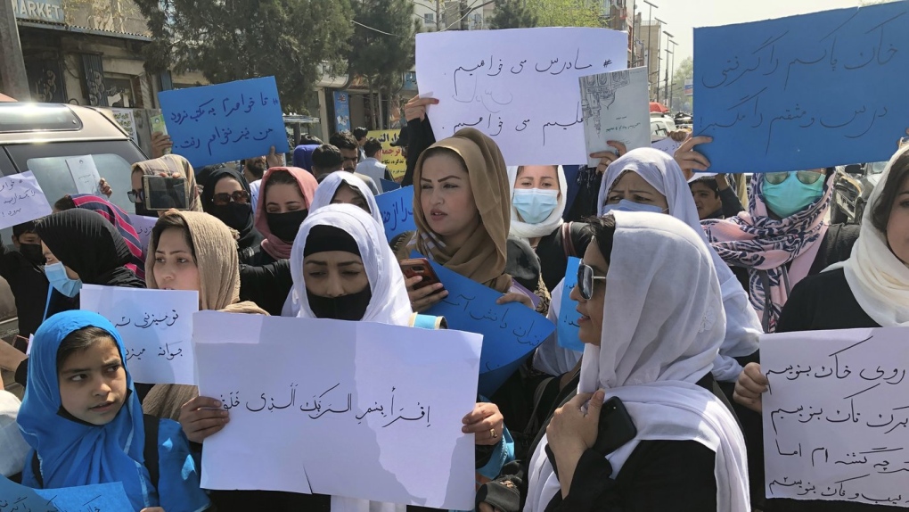Afghan women chant and hold signs at protest