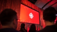 The CBC logo is projected onto a screen during the CBC's annual upfront presentation at The Mattamy Athletic Centre in Toronto, Wednesday, May 29, 2019. THE CANADIAN PRESS/Tijana Martin