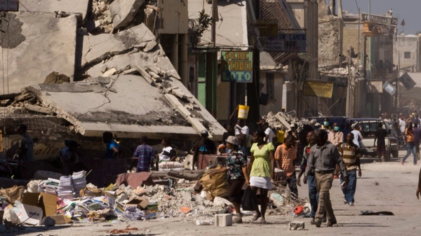 People make their way through the rubble in the earthquake-damaged downtown core of Port-au-Prince, Haiti, on Friday, January 29, 2010. (Ryan Remiorz / THE CANADIAN PRESS)