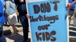 A demonstrator's sign can be seen at the Rally for Public Education at the Saskatchewan Legislature on April 29, 2023. (Luke Simard/CTV News)