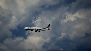 An Air Canada Boeing 777 is seen on approach to land at Vancouver International Airport in Richmond, B.C., on Tuesday, April 11, 2023. THE CANADIAN PRESS/Darryl Dyck