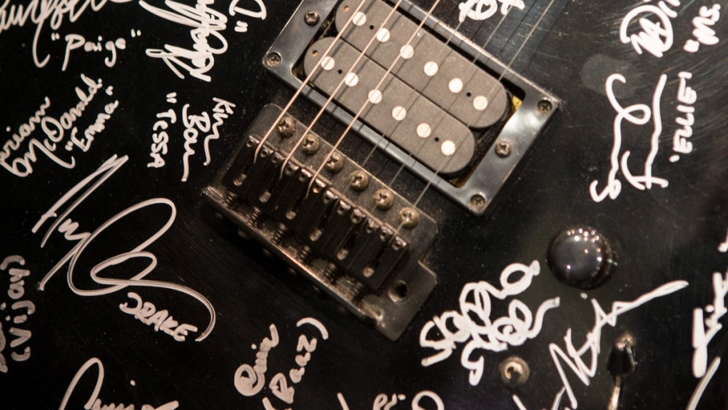 'Degrassi' cast signatures on a guitar