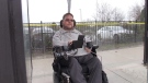 Edward Faruzel, KW AccessAbility Executive Director, at a bus stop on May 1, 2023. (Colton Wiens/CTV Kitchener)