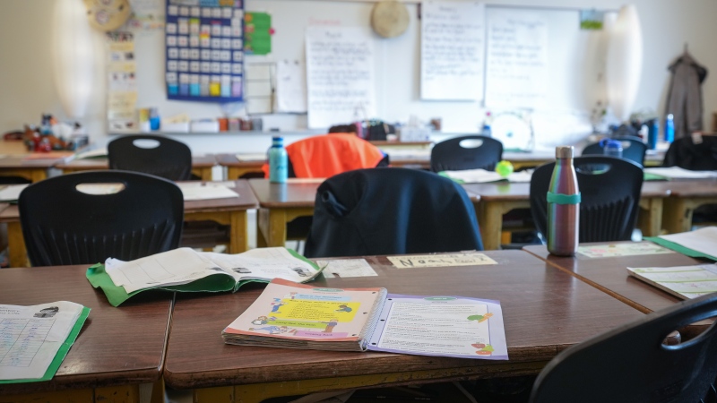 A workbook is seen on a student's desk in an elementary school classroom, in Vancouver, B.C., Thursday, April 13, 2023. THE CANADIAN PRESS/Darryl Dyck