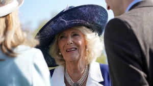 Camilla, the Queen Consort speaks with guests during a Garden Party at Buckingham Palace, London, Wednesday May 3, 2023, in celebration of the coronation of King Charles III on May 6. (Yui Mok/Pool via AP) 