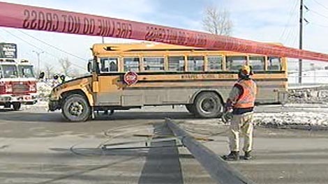 A vehicle collided into the pole, knocking the power lines onto the school bus. 