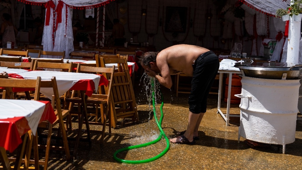 A man cools himself with water 