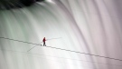 In this June 15, 2012 file photo, Nik Wallenda walks over Niagara Falls on a tightrope in Niagara Falls, Ontario. Wallenda finished his attempt to become the first person to walk on a tightrope 1,800 feet across the mist-fogged brink of roaring Niagara Falls. The seventh-generation member of the famed Flying Wallendas had long dreamed of pulling off the stunt, never before attempted. (AP Photo/The Canadian Press, Frank Gunn, File)
