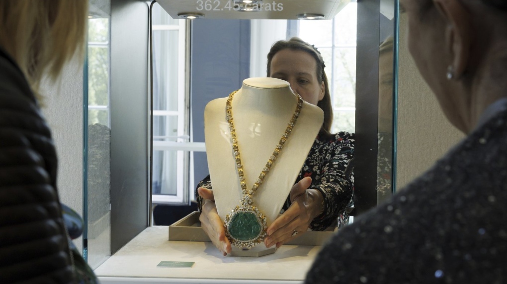 An employee of Christie's displays a Necklace