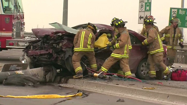 Vaughan Fire and Rescue Service work to free an injured driver from a vehicle involved in the crash, Tuesday, Feb. 2, 2010.