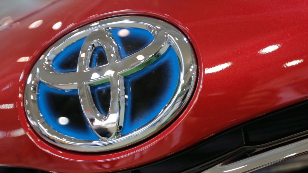 Toyota emblem on a showroom car in Tokyo