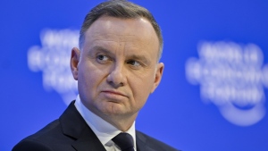 FILE - Andrzej Duda, President of Poland, left, addresses a panel session during the 53rd annual meeting of the World Economic Forum, WEF, in Davos, Switzerland, Wednesday, Jan. 18, 2023.(Gian Ehrenzeller/Keystone via AP) 