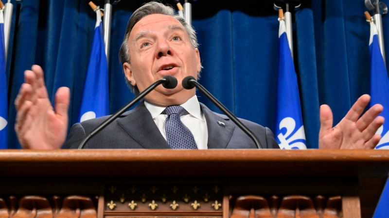 Quebec Premier Francois Legault responds to reporters questions before entering question period, Tuesday, March 28, 2023 at the legislature in Quebec City. THE CANADIAN PRESS/Jacques Boissinot