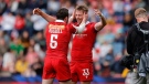 Alex Russell and Kalin Sager celebrate Canada’s cup quarterfinal win over Australia on Day 2 of the HSBC France Sevens on Saturday, May 13, 2023, at Stade Toulousain in Toulouse, France. THE CANADIAN PRESS/HO-World Rugby-Mike Lee