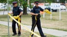 A file photo of police removing police tape near the scene of a shooting that took place at a school yard in Toronto. THE CANADIAN PRESS/Aaron Vincent Elkaim