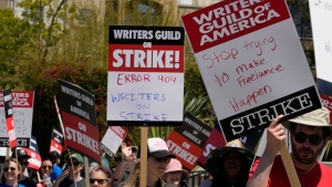 WGA members picket outside CBS Television City in the Fairfax District of Los Angeles, on May 2, 2023. (Damian Dovarganes / AP) 