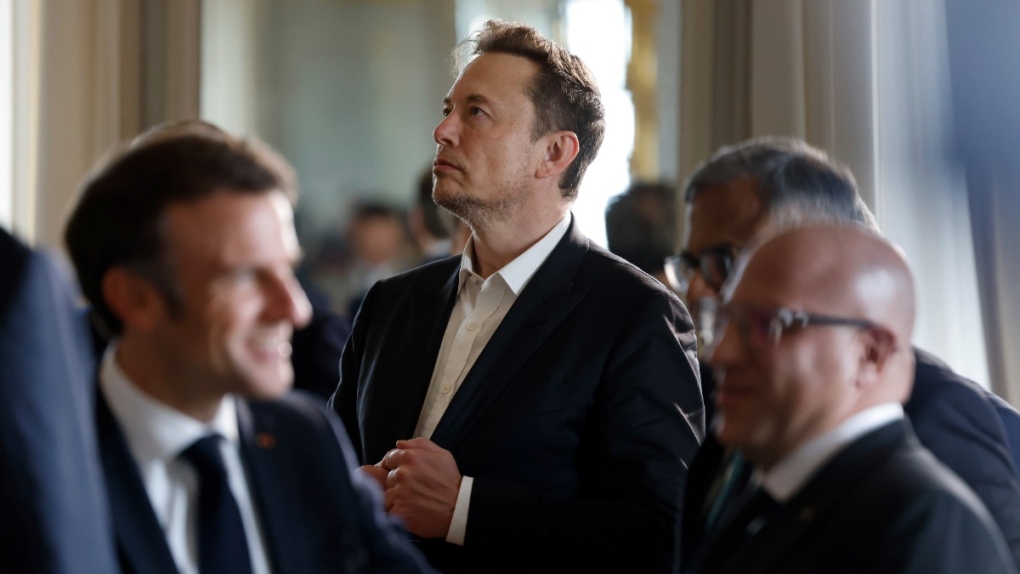 Tesla CEO Elon Musk, centre, in Versailles