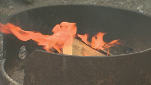 Fire burns in a pit in a file photo. 