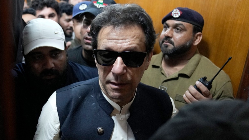 Former Pakistani Prime Minister Imran Khan, centre, after appearing in court in Lahore, Pakistan, on May 19, 2023. (K.M. Chaudary / AP) 