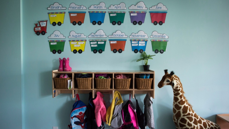 Children's backpacks and shoes are seen at a CEFA (Core Education and Fine Arts) Early Learning daycare franchise, in Langley, B.C., on May 29, 2018. THE CANADIAN PRESS/Darryl Dyck