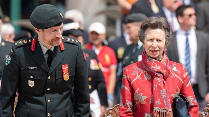 Princess Anne (right) and Colonel Gregory Kennedy Command, 37 Canadian Brigade Group share a funny moment during the 8th Canadian Hussars Exercise of the Freedom of the City of Moncton Parade on Saturday May 20, 2023.THE CANADIAN PRESS/Ron Ward