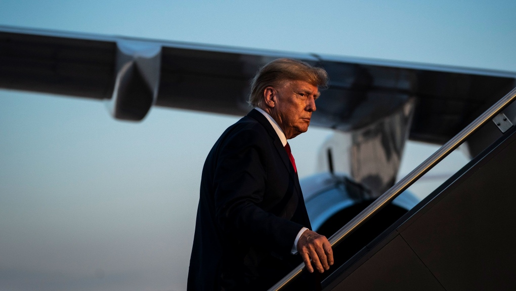 Donald Trump board a plane