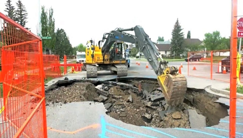 A sinkhole formed in the area of Cranston Boulevard and Cranston Drive S.E. on Tuesday, May 23, 2023. 