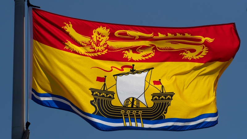 New Brunswick's provincial flag flies on a flag pole in Ottawa, Monday, July 6, 2020. (THE CANADIAN PRESS/Adrian Wyld)