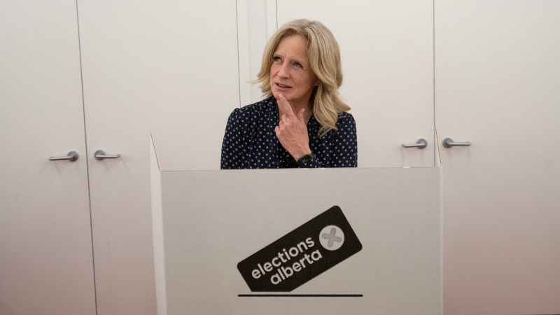 Alberta NDP Leader Rachel Notley jokes with the media before voting at an advance voting station for the upcoming provincial election in Calgary on Tuesday, May 23, 2023. THE CANADIAN PRESS/Todd Korol