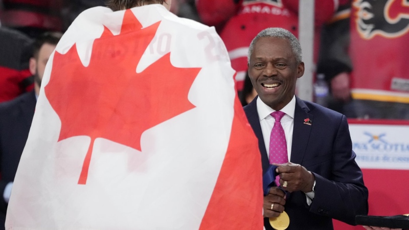 Hugh Fraser, Hockey Canada Board Chair, prepares the gold medals during the medal ceremony of the IIHF World Junior Hockey Championship gold medal game in Halifax on Thursday, January 5, 2023. (THE CANADIAN PRESS/Darren Calabrese)