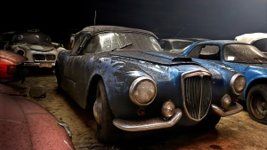 Car enthusiasts will be able to get their hands on a rare Lancia B24 Spider America when an impressive fleet of 230 classic cars discovered in warehouses and an abandoned church in Holland comes up for auction. (Gallery Aaldering)