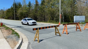 A police car is seen on a closed stretch of road while conducting an investigation. (James Morrison/CTV Atlantic)