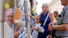 Tourists stop by souvenir shops near the Vatican, May 26, 2023. (AP Photo/Gregorio Borgia)