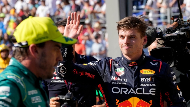 Red Bull driver Max Verstappen of the Netherlands, right, waves at the end of the Formula One qualifying session at the Monaco racetrack, in Monaco, May 27, 2023. (AP Photo/Luca Bruno)