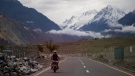 In this undated photo, a motorcycle drives down the Karakoram Highway in Gilgit-Baltistan, a mountainous province in northern Pakistan. THE CANADIAN PRESS/Salmaan Farooqi