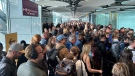People queue at arrivals at Heathrow airport in London, May 27, 2023. (Ivan Coninx via AP)